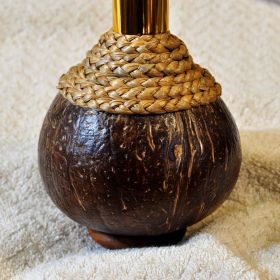 Pump dispenser in coconut and raffia for massage oils and cremes