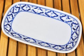 Rectangular ceramic plate with blue and white pattern...